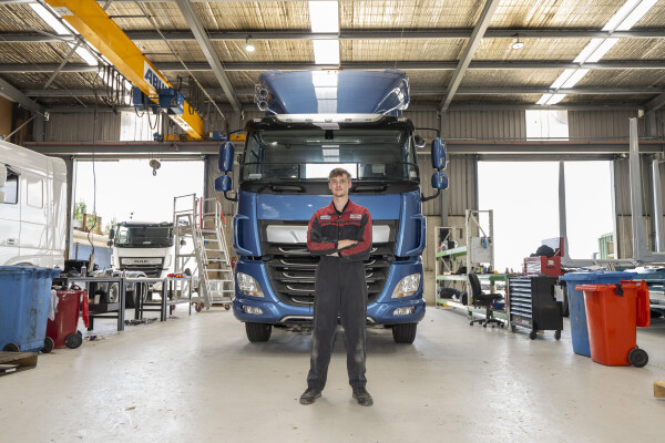 Terry Dorrell standing in front of a truck