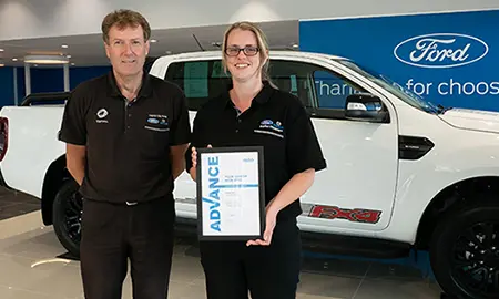 Amber Kay holding certificate in Ford